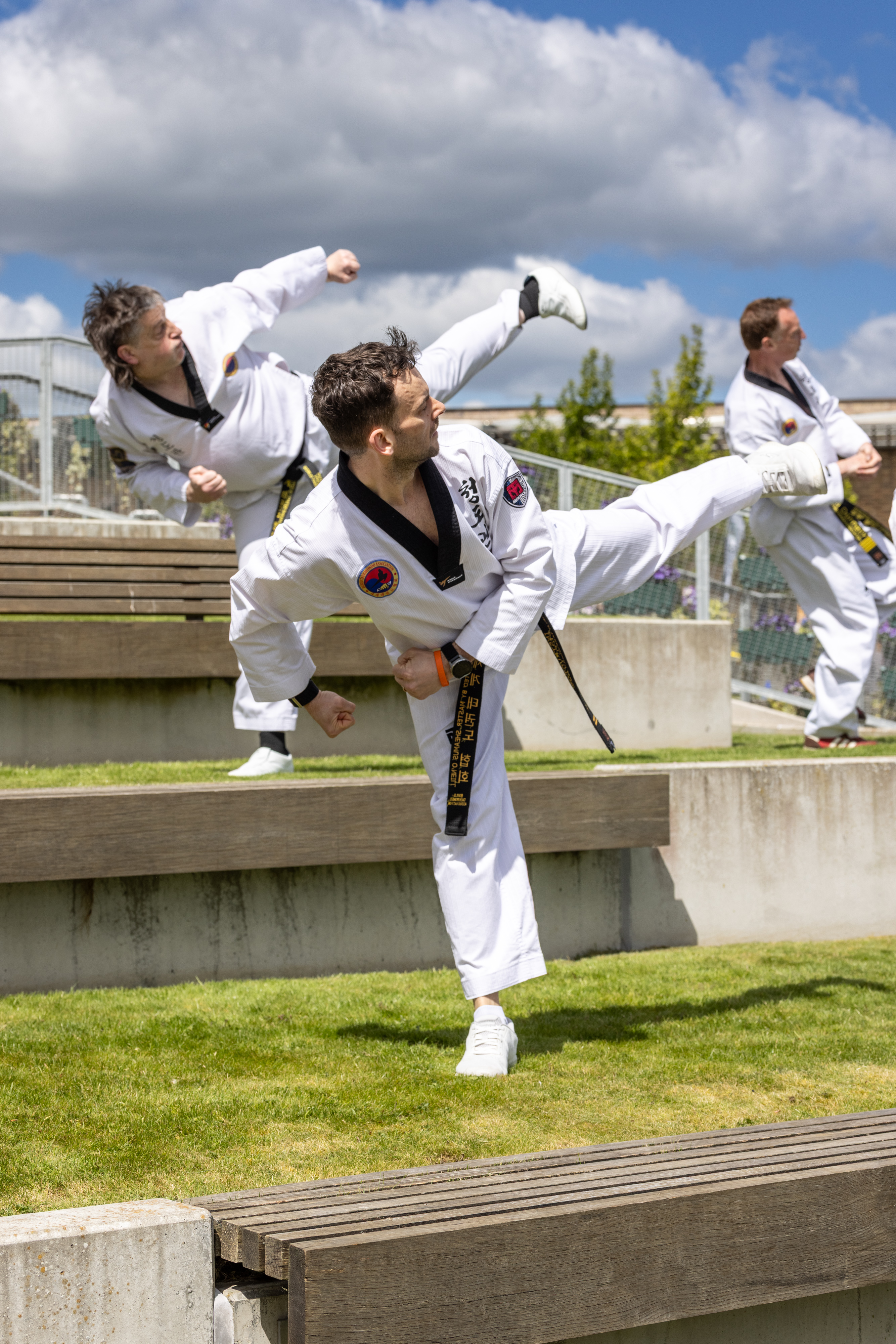 Taekwondo group kicking.